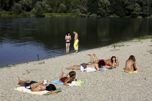 People relaxing on the Drava River in summer